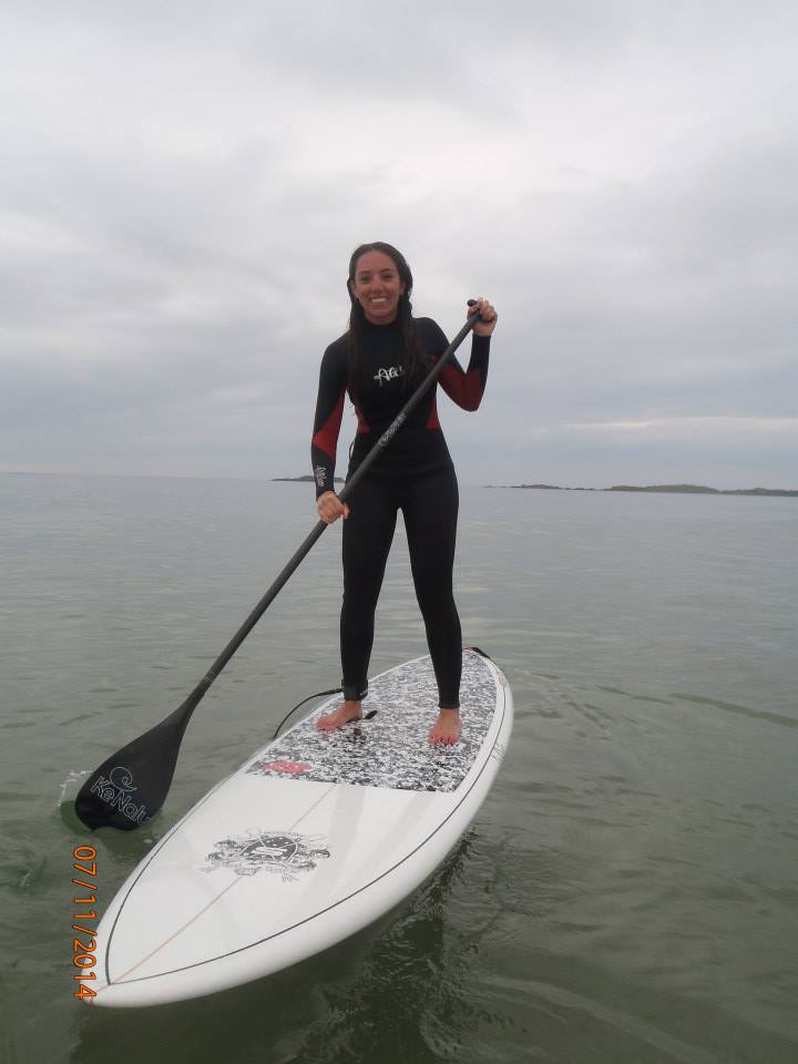 Kacey, skillfully balancing on a SUP. Skills: Map-reading. Memorable quotes: A Forrest Gump retelling of Fungi the Dingle dolphin story.