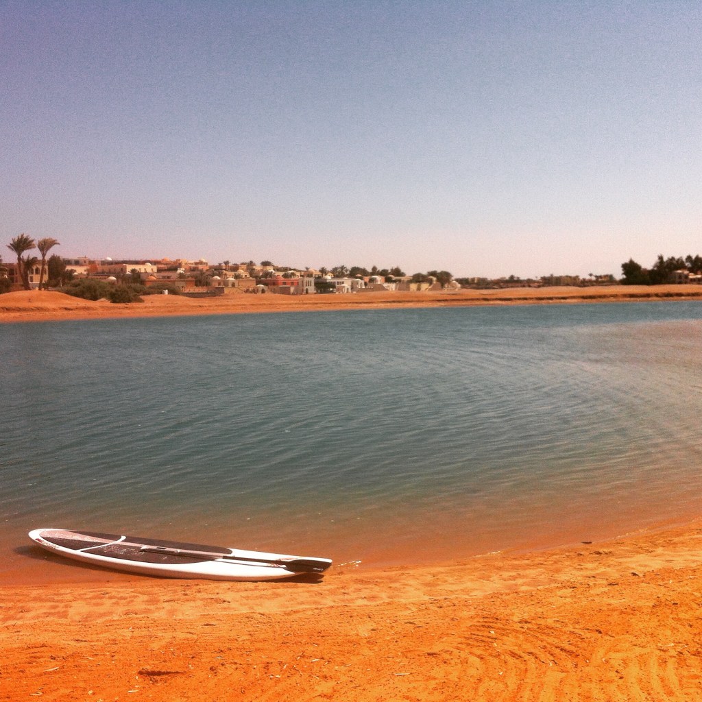 My SUP, relaxing on the beach. It is WAY heavier than it looks.
