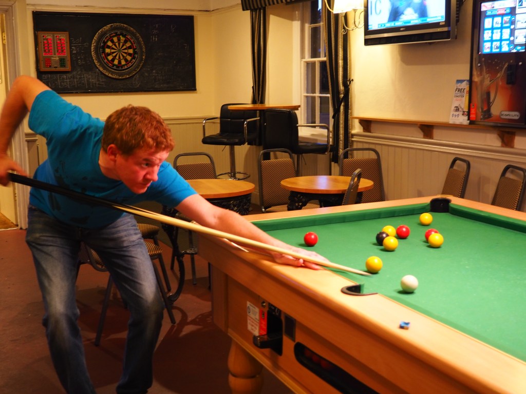 Jamie does his best at pool