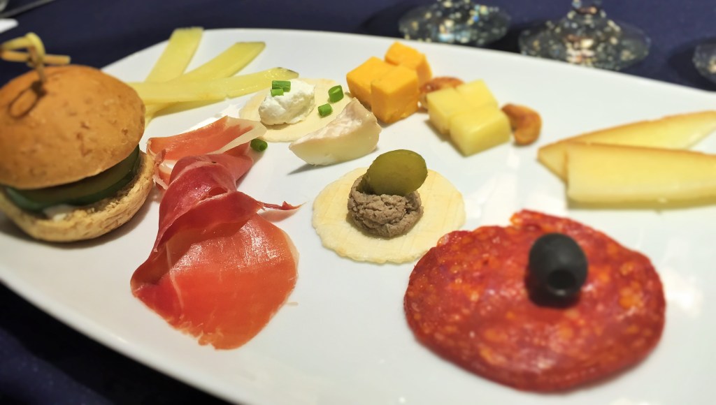 Clockwise from the cheddar: Emmental, smoked cheese, pamplona, pate, French goat cheese, ham Serrano, Filipino goat cheese, and I lost track of the rest.